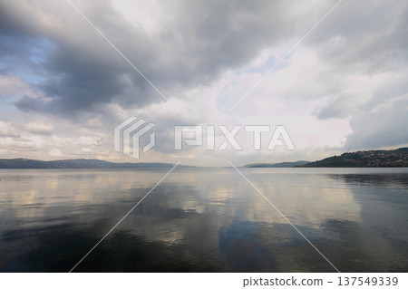 clouds reflected in the lake clouds reflected in the lake 137549339