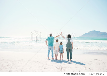 Family, beach and summer vacation on mockup in travel, outdoor holiday or together on sunny day. Rear view of father, mother and children on ocean coast for fun day, bonding or break at sea in nature 137549347