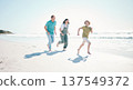 Running, travel and energy with family on beach for happy, freedom and summer vacation. Love, relax and adventure with people playing on seaside holiday for health, bonding and games together 137549372