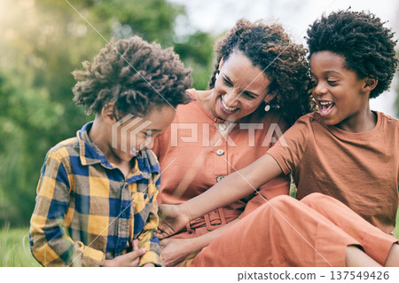 Happy, playful and mother with children in park for relax, bonding and love. Care, support and smile with woman and kids in grass field in nature for black family, summer and happiness together 137549426