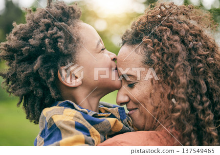 Love, kiss and mother with child in park for relax, bonding and happy. Care, support and smile with woman and young boy of black family hugging in nature for embrace, summer and happiness together Love, kiss and mother with child in park for relax, bonding and happy. Care, support and smile with woman and young boy of black family hugging in nature for embrace, summer and happiness together 137549465