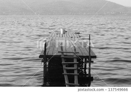 Old abandoned wooden fishing pier on the river in the countryside Old abandoned wooden fishing pier on the river in the countryside 137549666