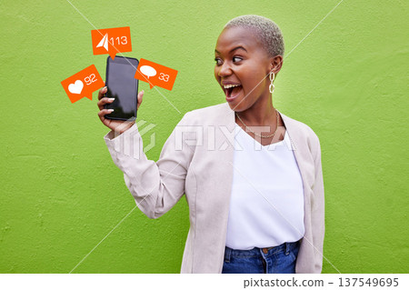 Social media, communication or phone icon with a woman at wall with message app. Excited African person with smartphone for online chat, network or platform notification overlay on green background Social media, communication or phone icon with a woman at wall with message app. Excited African person with smartphone for online chat, network or platform notification overlay on green background 137549695