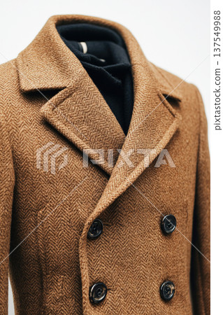 Modern warm classic coat displayed on a clothes mannequin against a white background Modern warm classic coat displayed on a clothes mannequin against a white background 137549988