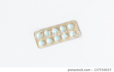 Blister pack of pills isolated on white background. Used medications. Pharmaceutical industry and pharmacies. Blister pack of pills isolated on white background. Used medications. Pharmaceutical industry and pharmacies. 137550037