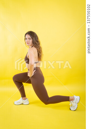 Woman exercising lunge for fitness and workout training 137550102