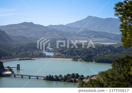 Scenic Guadalhorce reservoirs filled to the brim with water creating breathtaking natural landscape in Spain. Scenic Guadalhorce reservoirs filled to the brim with water creating breathtaking natural landscape in Spain. 137550817