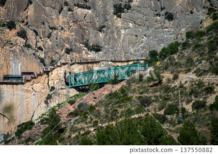 Caminito del Rey, The King's Path. Walkway pinned along the steep walls of a narrow gorge in Andales, Spain 137550882