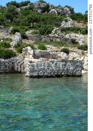 A small seaside town Antalya. Flooded ancient Lycian city as a result of the earthquake city. Near the city of Simena in the vicinity of Kekova Turkey. A small seaside town Antalya. Flooded ancient Lycian city as a result of the earthquake city. Near the city of Simena in the vicinity of Kekova Turkey. 137551798