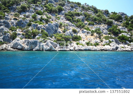 A small seaside town Antalya. Flooded ancient Lycian city as a result of the earthquake city. Near the city of Simena in the vicinity of Kekova Turkey. A small seaside town Antalya. Flooded ancient Lycian city as a result of the earthquake city. Near the city of Simena in the vicinity of Kekova Turkey. 137551802