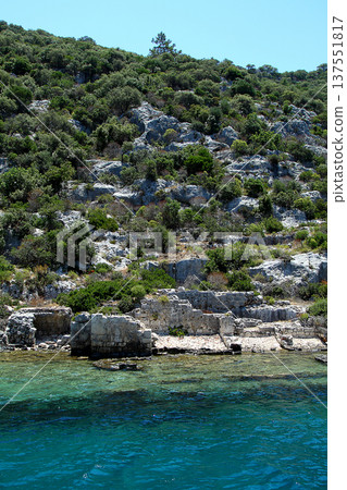 A small seaside town Antalya. Flooded ancient Lycian city as a result of the earthquake city. Near the city of Simena in the vicinity of Kekova Turkey. A small seaside town Antalya. Flooded ancient Lycian city as a result of the earthquake city. Near the city of Simena in the vicinity of Kekova Turkey. 137551817