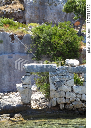A small seaside town Antalya. Flooded ancient Lycian city as a result of the earthquake city. Near the city of Simena in the vicinity of Kekova Turkey. A small seaside town Antalya. Flooded ancient Lycian city as a result of the earthquake city. Near the city of Simena in the vicinity of Kekova Turkey. 137551832