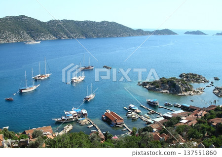 Simena (Kalekoy) ancient ruin site with sarcophagus by historic Simena castle, Turkey by Kekova islands. 137551860