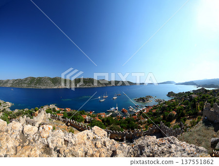 Simena (Kalekoy) ancient ruin site with sarcophagus by historic Simena castle, Turkey by Kekova islands. 137551862