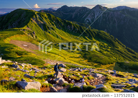 Climbers walking along the ridge of Mount Sugoroku in the Northern Alps, with views of Mount Mitsumatarenge, Mount Washu, and Mount Suisho 137552015