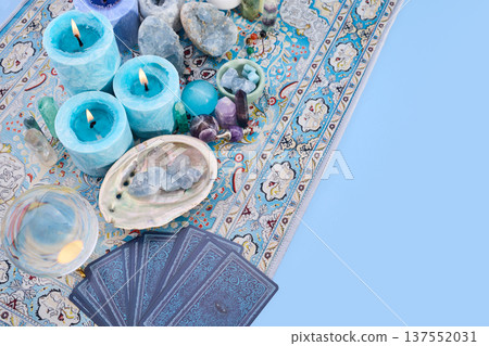 Blue candles, crystals, and tarot cards for divination Blue candles, crystals, and tarot cards for divination 137552031