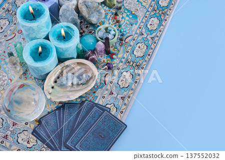 Tarot cards and crystals on a bohemian carpet for divination Tarot cards and crystals on a bohemian carpet for divination 137552032