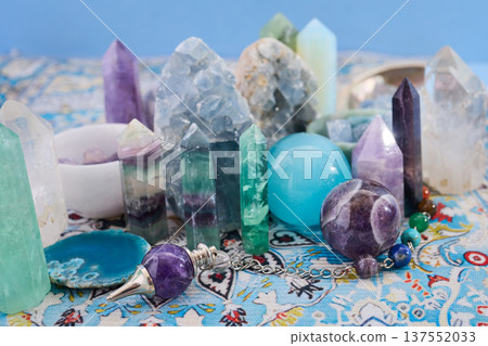 Crystals and pendulums representing spiritual healing and wellness 137552033