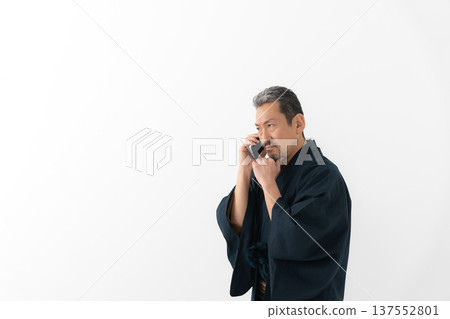 Man wearing kimono, smartphone, smartphone Man wearing kimono, smartphone, smartphone 137552801