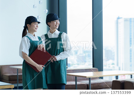 Portrait of a female employee working at a restaurant Portrait of a female employee working at a restaurant 137553399