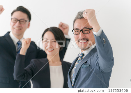 Business person who makes a guts pose 137553406