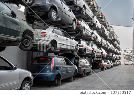 Stacked cars in scrapyard with multiple vehicles Stacked cars in scrapyard with multiple vehicles 137553517