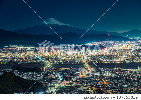 Night view of snow-capped Mount Fuji and Shizuoka City illuminated by moonlight from Chosun Rock in early spring Night view of snow-capped Mount Fuji and Shizuoka City illuminated by moonlight from Chosun Rock in early spring 137553819