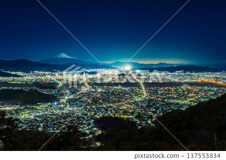 Night view of snow-capped Mount Fuji and Shizuoka City illuminated by moonlight from Chosun Rock in early spring Night view of snow-capped Mount Fuji and Shizuoka City illuminated by moonlight from Chosun Rock in early spring 137553834
