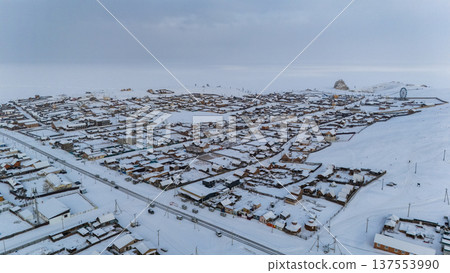 Aerial view of Khuzhir village the largest village on Olkhon island, Russia during winter season. Aerial view of Khuzhir village the largest village on Olkhon island, Russia during winter season. 137553990