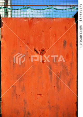 Rusty iron plate that looks like a face Rusty iron plate that looks like a face 137554574