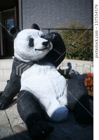 Giant panda model at a housing exhibition center Giant panda model at a housing exhibition center 137554579