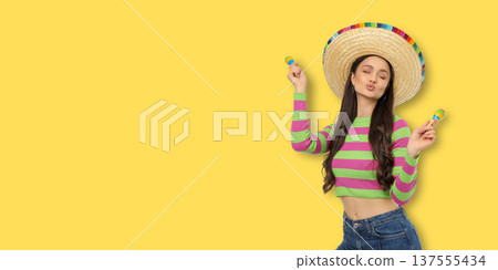 Young woman in sombrero celebrates Cinco de Mayo 137555434