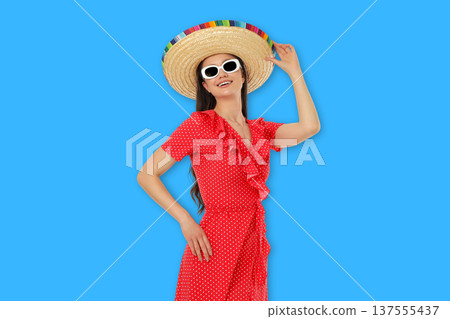Cinco de Mayo, A young woman wears a vibrant sombrero and dress Cinco de Mayo, A young woman wears a vibrant sombrero and dress 137555437