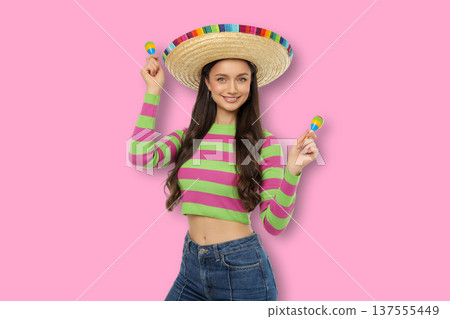 Cinco de Mayo, A young woman wears a sombrero and holds maracas 137555449