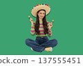 Cinco de Mayo, Young woman joyfully celebrating with maracas 137555451
