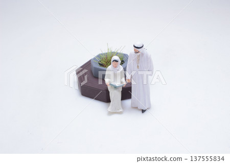 Miniature figures interacting beside planter bench in studio Miniature figures interacting beside planter bench in studio 137555834