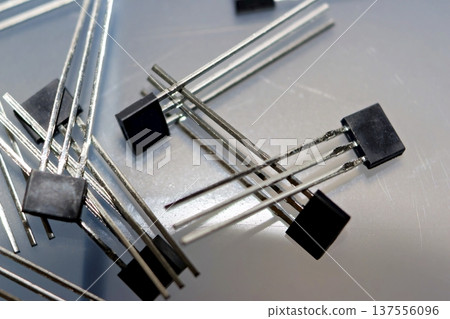 Essential 41F Hall effect sensors, core electronic components for precise electric bicycle motor control. Tech, DIY, and repair backdrop 137556096