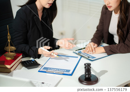 Compassionate lawyer providing legal consultation and emotional support to client, concept of dispute resolution, corporate law, contract advice 137556179