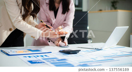 Business team collaboration discussing working analyzing with financial data and marketing growth report graph in team, presentation and digital tablet, laptop. 137556189