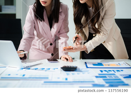 Business team collaboration discussing working analyzing with financial data and marketing growth report graph in team, presentation and digital tablet, laptop. 137556190