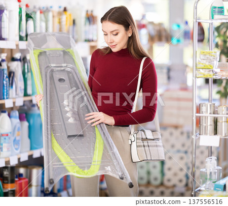 Woman choosing a folding board 137556516