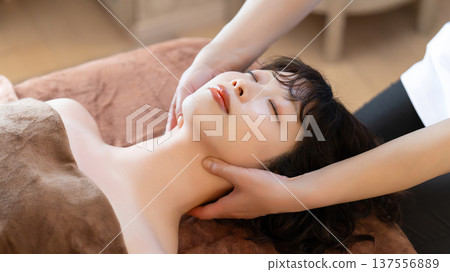 A woman receiving beauty treatment and massage 137556889