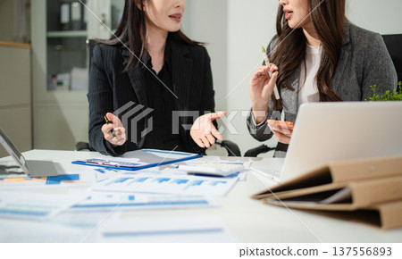Team work process. Photo young business crew working with new startup project. Project managers meeting. Analyze plans, papers. 137556893