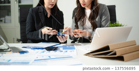 Business team collaboration discussing working analyzing with financial data and marketing growth report graph in team, presentation and digital tablet, laptop. 137556895