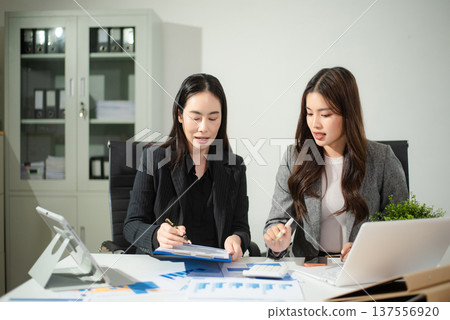 Team work process. Photo young business crew working with new startup project. Project managers meeting. Analyze plans, papers. Team work process. Photo young business crew working with new startup project. Project managers meeting. Analyze plans, papers. 137556920