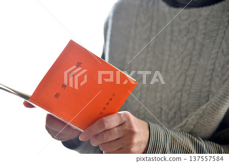 Seniors checking their pension book Seniors checking their pension book 137557584