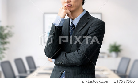 A male businessman thinking 137557590