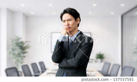 A male businessman thinking A male businessman thinking 137557591