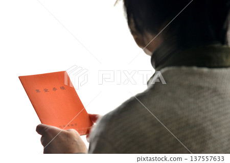 Seniors checking their pension book Seniors checking their pension book 137557633