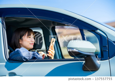 Woman on a road trip 137557755